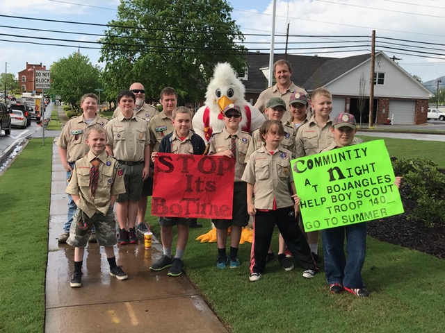 Boy scout troop holding signs for community night at Bojangles'
