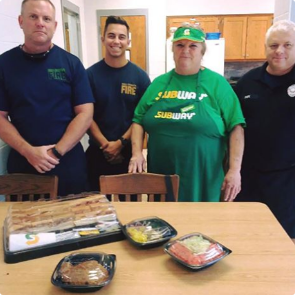 Subway employee with firefighters