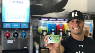 Man displaying a clipper fuel savers card