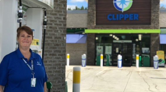 Employee in front of Clipper location